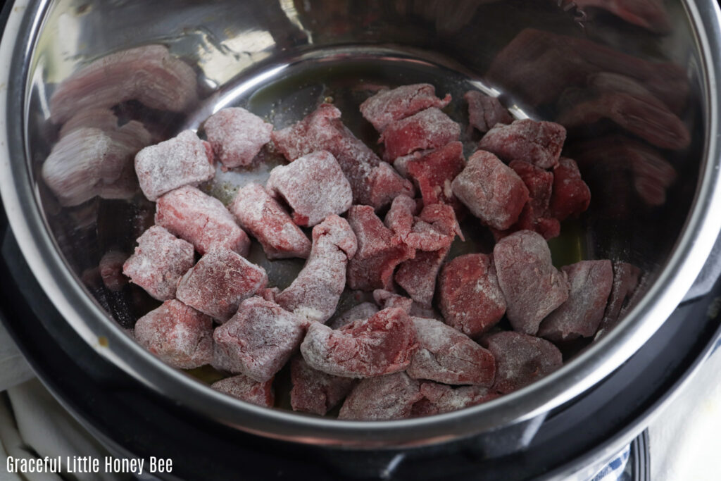 Flour coated stew meat, browning in the Instant Pot.