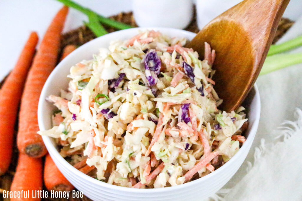 A white bowlful of Cajun Coleslaw.